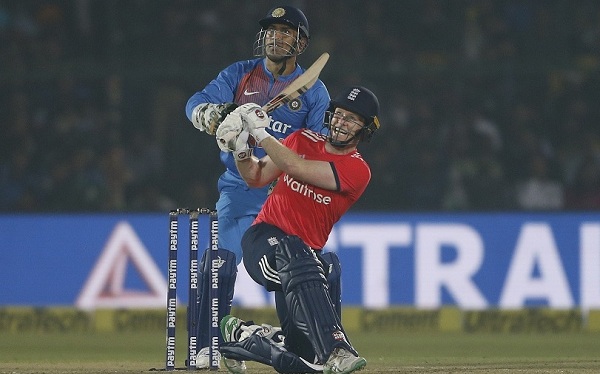 England's captain Eoin Morgan hits a six during their first Twenty20 cricket match against India at Green Park stadium in Kanpur, India, Thursday, Jan. 26, 2017. (AP Photo/Altaf Qadri)