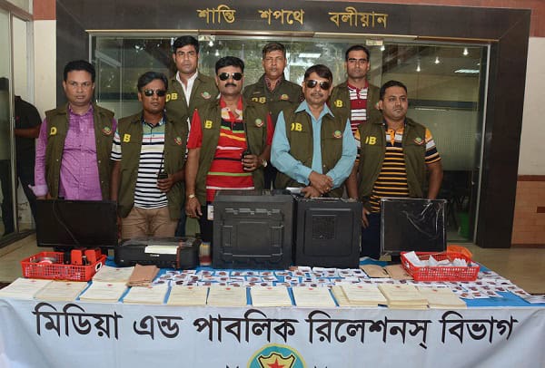 Police officials display fake police clearance certificates seized in Bangladesh. Channel i News - চ্যানেল আই নিউজ