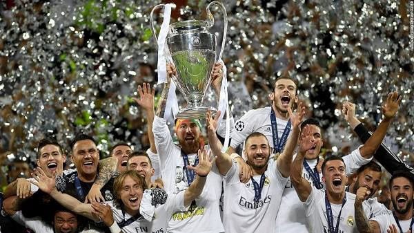 Real Madrid celebrating their 17th Champions League title victory with trophy and confetti. Channel i News - চ্যানেল আই নিউজ