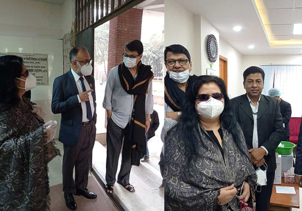 অফিসে করোনার ভ্যাকসিন নেওয়া ব্যক্তিরা, সবাই মাস্ক পরেছেন. Channel i News - চ্যানেল আই নিউজ
