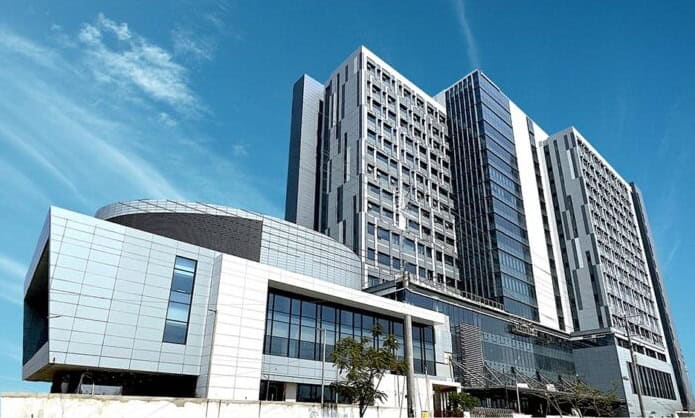 Modern multi-story hospital building with glass facade in Bangladesh. Channel i News - চ্যানেল আই নিউজ