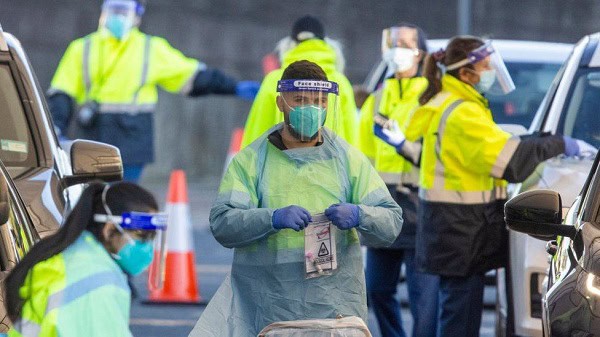COVID-19 testing team conducts tests at a drive-through site in Sydney. Channel i News - চ্যানেল আই নিউজ