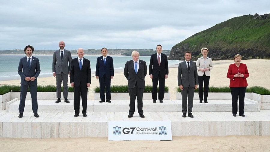 G7 leaders standing outdoors at Cornwall summit with ocean background. Channel i News - চ্যানেল আই নিউজ