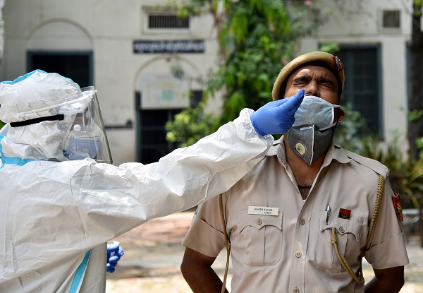 New Delhi, Aug 02 (ANI): A health worker in personal protective equipment (PPE) collects a nasal sample from a Delhi Police Constable at a local health centre to conduct tests for the coronavirus disease (COVID-19), amid the spread of the disease, in New Delhi on Sunday. (ANI Photo)