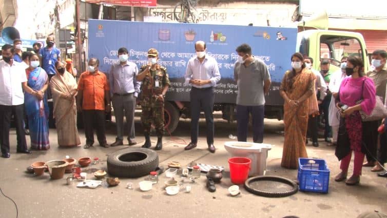 Bangladesh police and officials inspect recovered stolen items on the street. Channel i News - চ্যানেল আই নিউজ