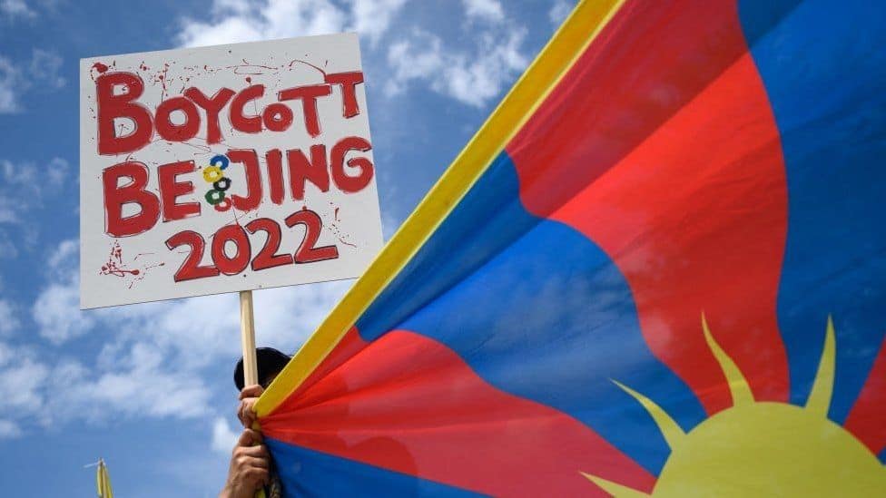 Boycott Beijing 2022 protest sign held against the Olympics. Channel i News - চ্যানেল আই নিউজ