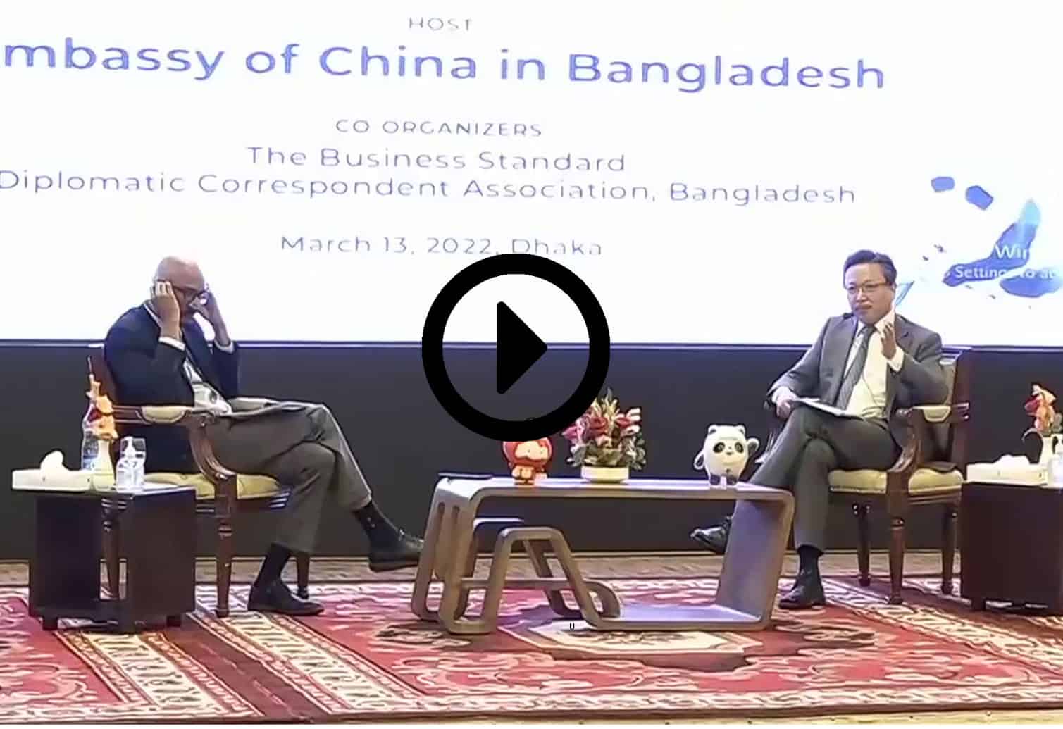 চীন দূতাবাসের অনুষ্ঠানে দুই ব্যক্তি আলোচনা করছেন. Channel i News - চ্যানেল আই নিউজ