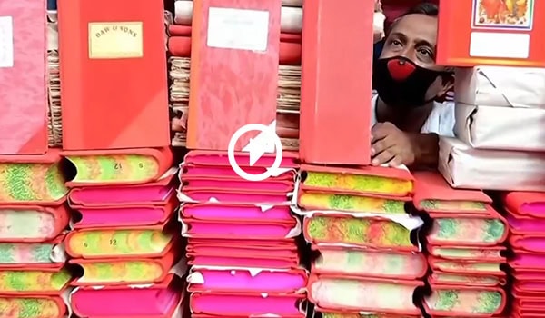 পূজা ও হালখাতার প্রস্তুতির জন্য পুঁথি ও বই সাজানো. Channel i News - চ্যানেল আই নিউজ