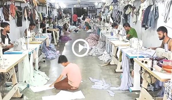 কারখানায় ঈদের পোশাক তৈরির ব্যস্ততা, শ্রমিকরা কাজ করছেন।. Channel i News - চ্যানেল আই নিউজ