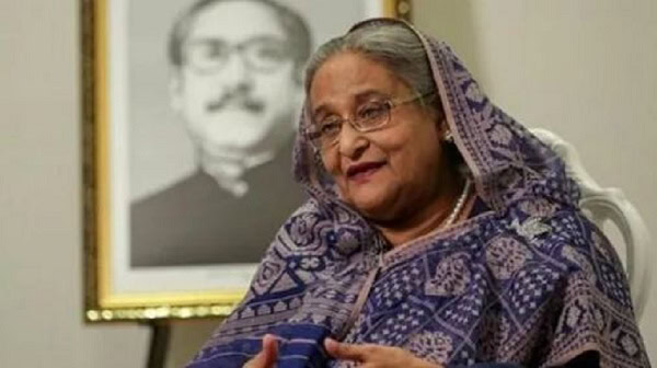 প্রধানমন্ত্রী speaking during an interview or press conference. Channel i News - চ্যানেল আই নিউজ