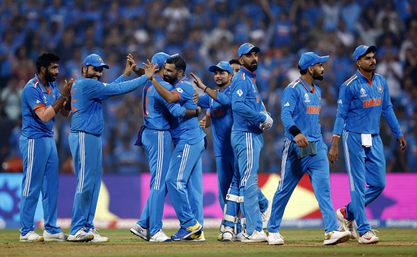 MUMBAI, INDIA - NOVEMBER 15: Mohammed Shami of India celebrates with teammates after dismissing Daryl Mitchell of New Zealand (not pictured) during the ICC Men's Cricket World Cup India 2023 Semi Final match between India and New Zealand at Wankhede Stadium on November 15, 2023 in Mumbai, India. (Photo by Darrian Traynor-ICC/ICC via Getty Images)