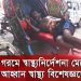 A man resting on a rickshaw in a busy street scene in Bangladesh. Channel i News - চ্যানেল আই নিউজ
