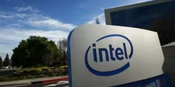 Intel logo on a modern building exterior in daylight. Channel i News - চ্যানেল আই নিউজ