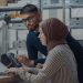 Two engineers working with electronic equipment in a laboratory setting. Channel i News - চ্যানেল আই নিউজ