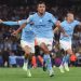 Manchester City players celebrating a goal during a match. Channel i News - চ্যানেল আই নিউজ