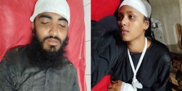 আহত দুই ব্যক্তি হাসপাতালে চিকিৎসাধীন, মাথায় সাদা কাপড় পেঁচানো. Channel i News - চ্যানেল আই নিউজ