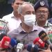 স্বরাষ্ট্র উপদেষ্টা সাংবাদিকদের প্রশ্নের উত্তর দিচ্ছেন, মুখে মাস্ক পরা. Channel i News - চ্যানেল আই নিউজ