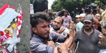 প্রতিবাদরত ব্যক্তিরা ধাক্কাধাক্কি করছে, বেশ কিছু মানুষ উপস্থিত. Channel i News - চ্যানেল আই নিউজ