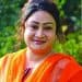 বাংলাদেশের একজন নারী সাংবাদিক, হাসিমুখে ক্যামেরার দিকে তাকাচ্ছেন. Channel i News - চ্যানেল আই নিউজ