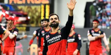 Bangladeshi cricket player waving to fans during a match. Channel i News - চ্যানেল আই নিউজ