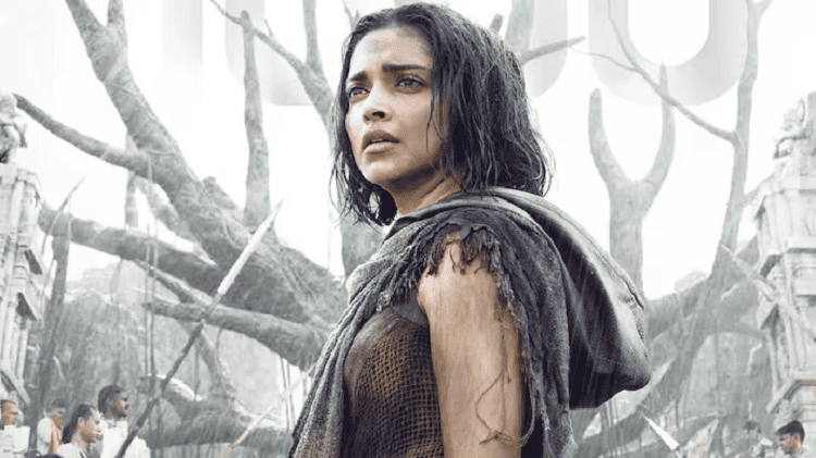 অভিনেত্রী দীপিকা পাড়ুকোনের ছবি, তিনি একটি ধ্বংসপ্রাপ্ত পরিবেশে দাঁড়িয়ে আছেন।. Channel i News - চ্যানেল আই নিউজ