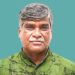 সাজ্জাদ জহির চন্দন বক্তৃতা দিচ্ছেন, পটভূমিতে সবুজ রঙের ব্যাকড্রপ. Channel i News - চ্যানেল আই নিউজ