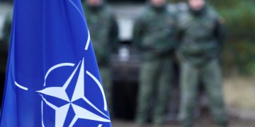 NATO flag is seen during NATO enhanced Forward Presence battle group military exercise Silver Arrow in Adazi, Latvia October 5, 2019. REUTERS/Ints Kalnins